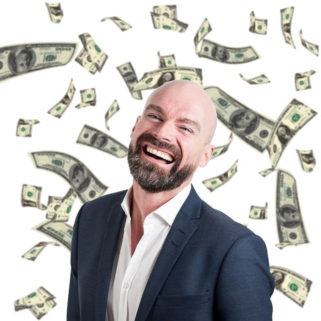 rich & wealthy: a bald man with money flying in background